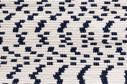 White and navy rug